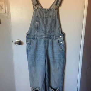 H&M light blue denim overalls, distressed knees, straight leg